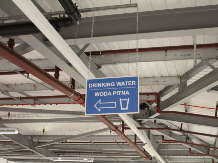 Signs at the warehouse, where many workers are from Poland, are displayed in both English and Polish.