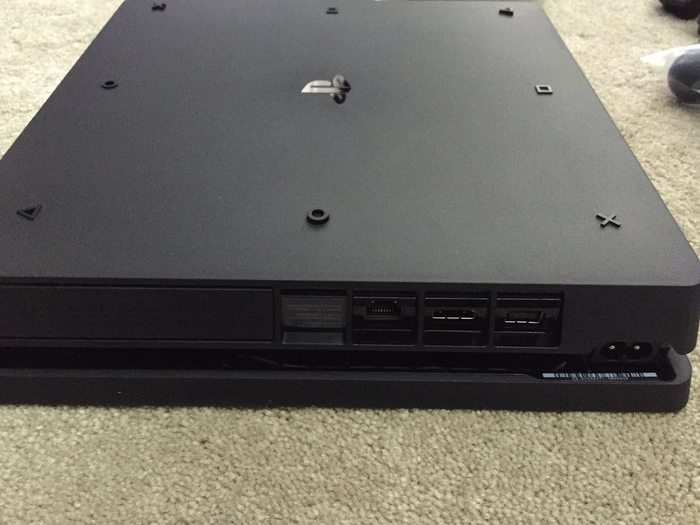 The underside of the PS4 features a fun nod to the the buttons on its controller, with raised versions of them functioning as the feet of the console.