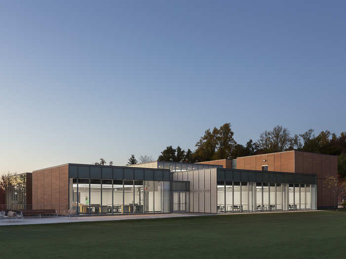 The warm cedar exterior of the the Dwight-Englewood School Hajjar STEM Center helps it blend into the surrounding woods.