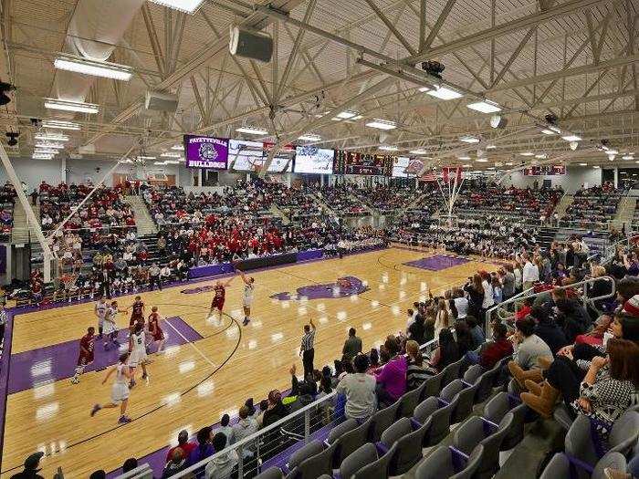 Instead of standard bleachers, its gymnasium has stadium seating.