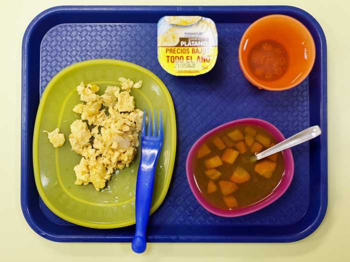 MADRID, SPAIN: Another Spanish lunch consists of an omelet, vegetable soup, banana yogurt, and water.