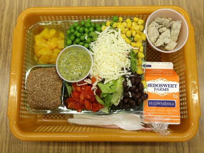 SEATTLE, US: Another lunch option at the same school is a salad with low-sodium chicken, a whole-grain roll, fresh red peppers, peas, corn, and beans with cilantro dressing.