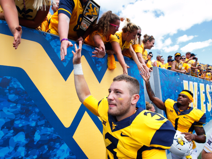 2. West Virginia University — Mountaineers love WVU for its balance of academics and athletics. One student describes it: "[It