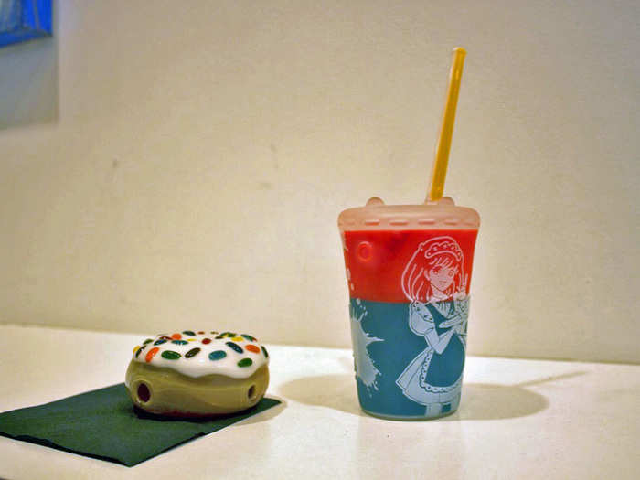 These look like mere sculptures of a donut and soda cup.