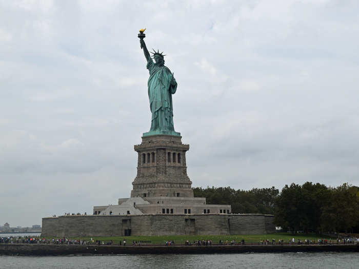 The NYC ferry makes a quick stop at Liberty Island. For a few seconds, you