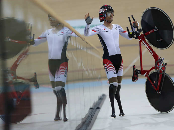 Fujita Masaki of Japan waves after competing in the velodrome.