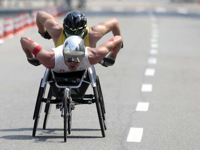 Two racers compete in the wheelchair marathon.