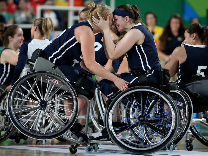 Members of Team USA celebrate winning gold in wheelchair basketball.