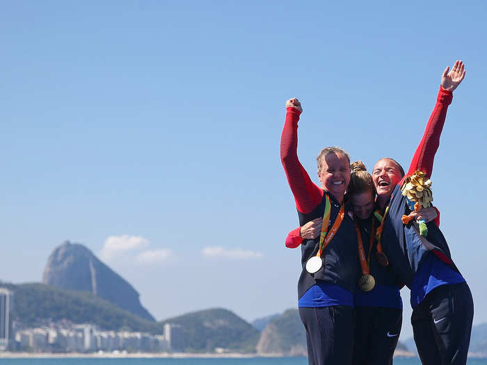 Silver medalist Hailey Danisewicz (left), Gold medalist Allysa Seely (center), and Bronze medalist Melissa Stockwell (right), all of Team USA, celebrate their medals in the women