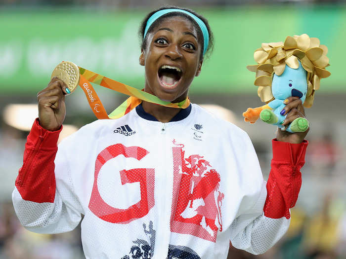 Kadeena Cox celebrates her gold medal in cycling.