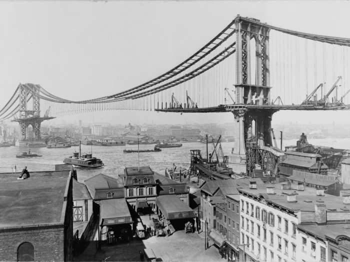 So the city invested in infrastructure — like the Manhattan Bridge, pictured here in 1909 — to support its burgeoning population.