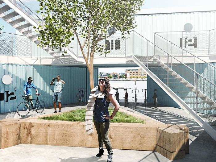 Each unit contains six shipping containers arranged in triangles. The center space here has a courtyard.