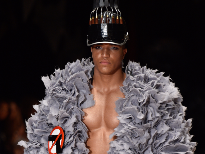 12. This male model wore an extremely frilly jacket with an anti-gun political message at the Vin & Omi LFW show on September 19, paired with a spiked hat.