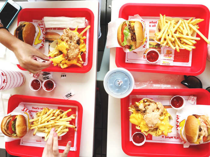 Significantly smaller, the In-N-Out burger has a sweeter taste, no pickles, and no mustard. Packed with ingredients, it took two bites to get to the actual burger patty.