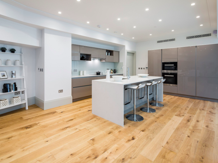 And of course, the kitchen has a fully fitted designer kitchen and 10 seat dining area. There is also a stone topped-central island with a breakfast bar.