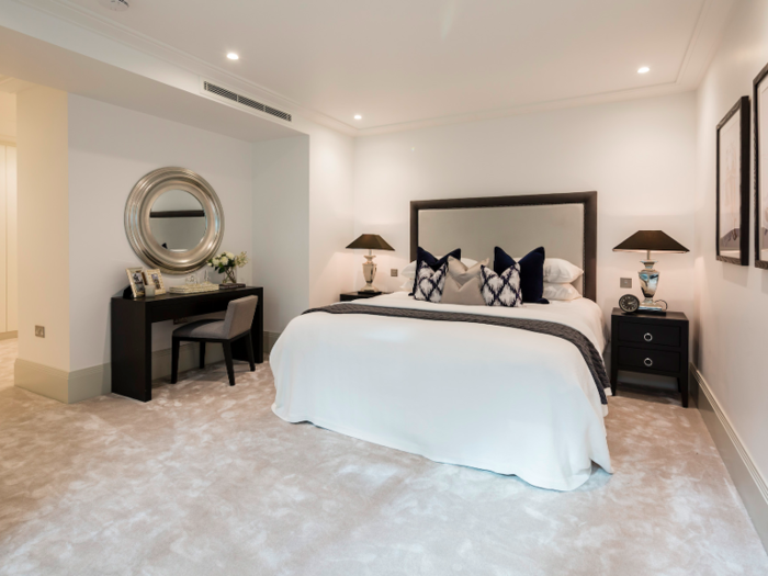 The master bedroom suite has a walk in dressing room with bespoke shelving and a master bathroom.