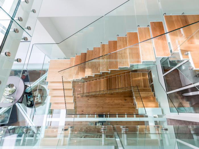 Inside is an architectural wonder. The entrance hall is surrounded by glass including a glass floor and glass ceiling which makes the house look even bigger than it is.