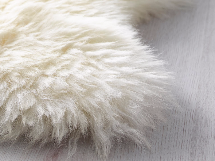 5. The Rens sheepskin rug brings warmth into your home.