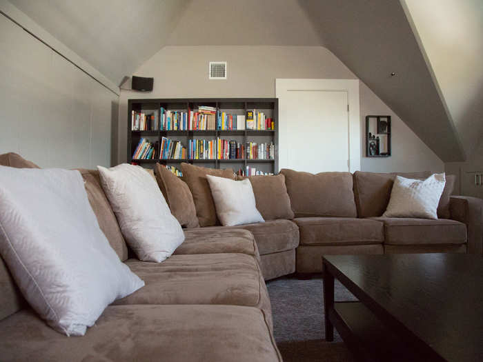 A wraparound couch and media center makes for a relaxing entertainment zone.