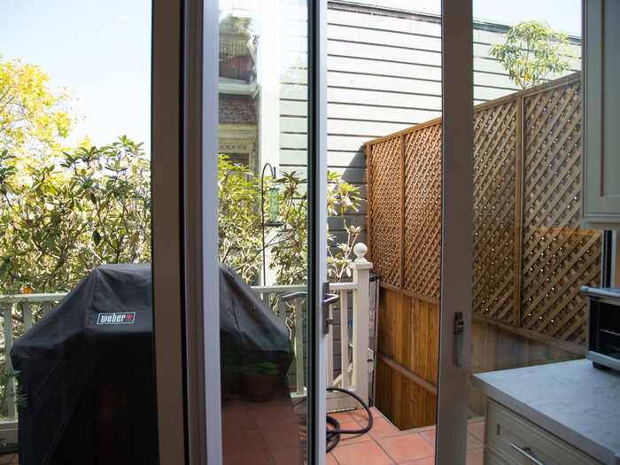 A backyard is hard to come by in San Francisco, even on big properties. French doors open onto a small deck, which has room for a grill and potted plants.