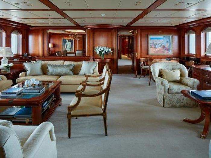 The yacht comes with plenty of plush couches and seats inside.