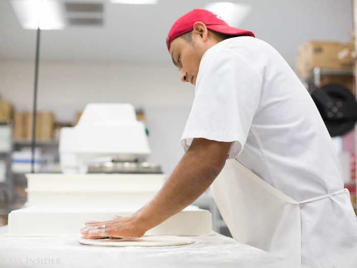 To make the pizza, a human stretches and shapes the dough, which Zume lets rise for 48 hours for a lighter, spongier texture. The long fermentation process makes it easier to digest, Collins says.