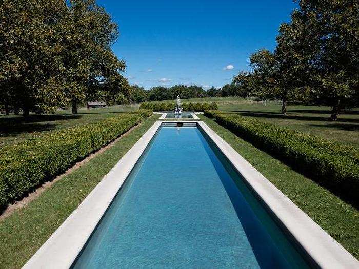 From the north wing, a reflecting pool and fountain are reminiscent of a French chateau.