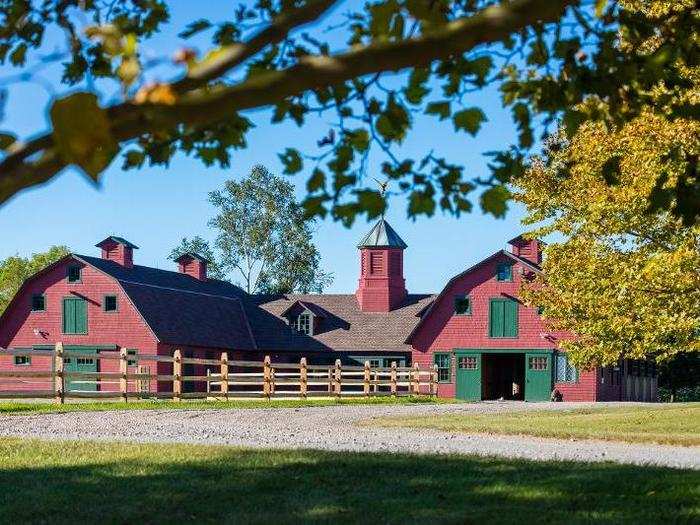 The equestrian facilities include a stable and riding ring.