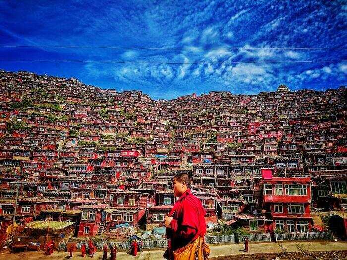 This photographer was travelling to Sertar County in China when he visited the local Buddhist Insititute and snapped this picture of a monk walking by.