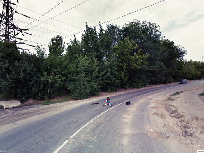 Why was this girl sitting in the middle of the road ...