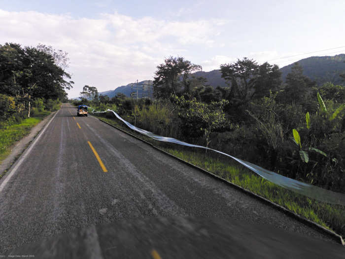 The tape dangling behind the truck pictured below, for example, is perfectly aligned with the edge of the road: