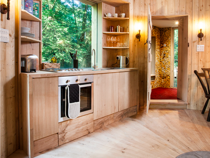 The kitchen is finished to a high standard, featuring an oven, toaster, kettle and utensils.