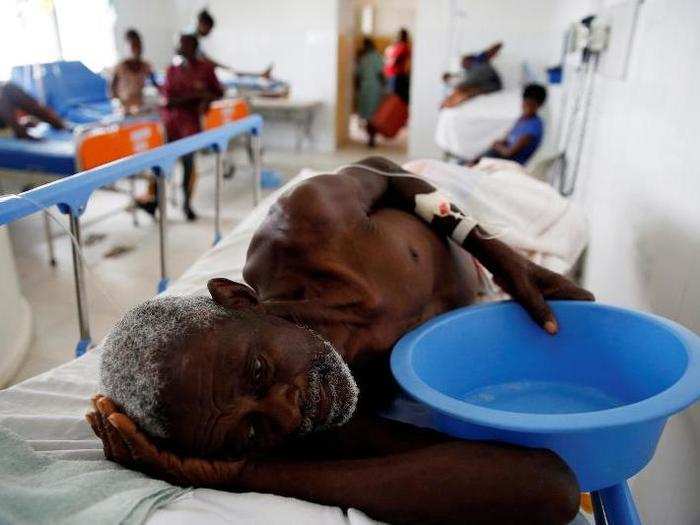 An injured man recovers at the hospital after Hurricane Matthew passed Jérémie.