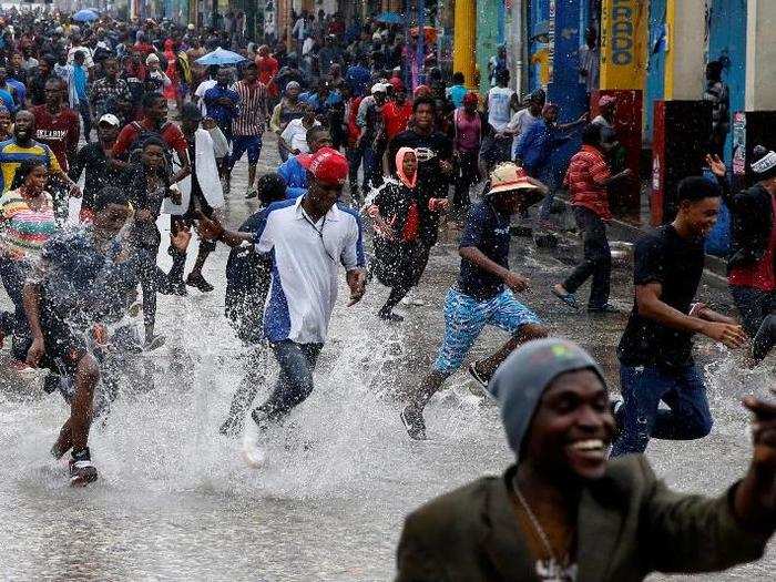 Citizens take part in a gathering while Hurricane Matthew passes in Port-au-Prince.