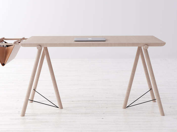 VM Desk is a stylish desk with a leather bag organizer.