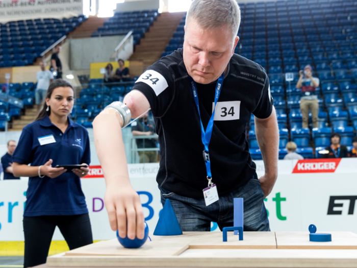 In the Powered Arm Prosthesis Race, competitors who are missing part or all of a limb will test their dexterity in picking up and transporting various odd-shaped objects.