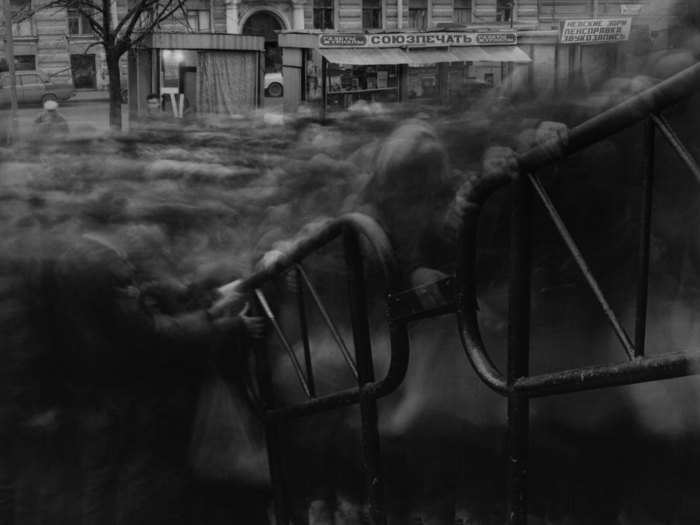 Alexey Titarenko depicts St. Petersburg after the fall of Communism, using long exposures to reduce crowds to smoke.