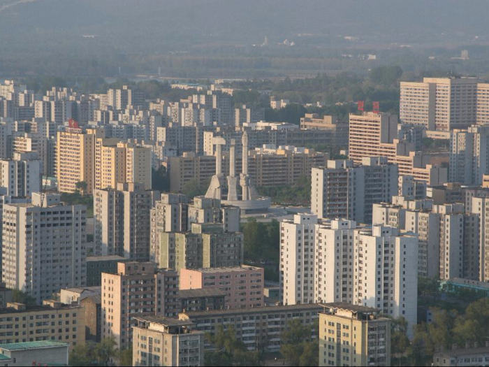 Whatever bright spots there may be, from far away the skyline clearly reveals North Korea