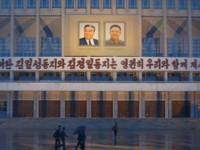 One building in central Pyongyang reads, "The great comrades Kim Il Sung and Kim Jong Il will be with us forever."