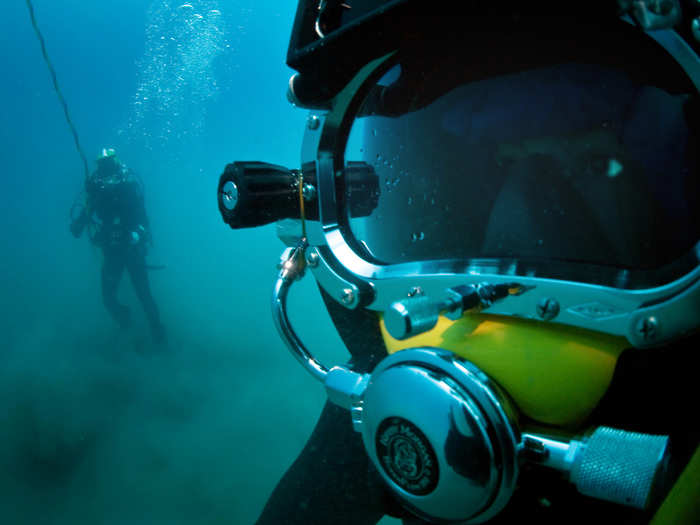 The US Navy provides air, land, and sea support to the military. These divers search the sea floor during a salvage recovery exercise in 2010.