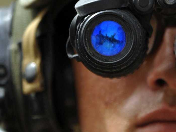 A Navy sailor working in an expeditionary command tests his night-vision goggles before setting off on another night patrol through Iraq’s waterways in 2007.