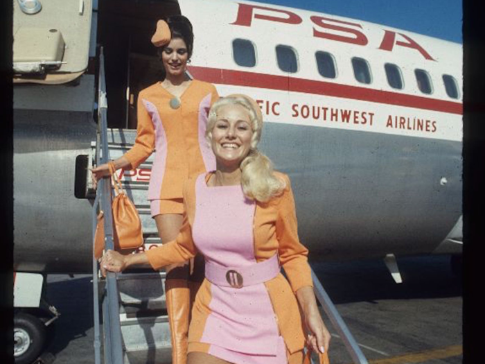 PSA flight attendants disembark from an airplane.