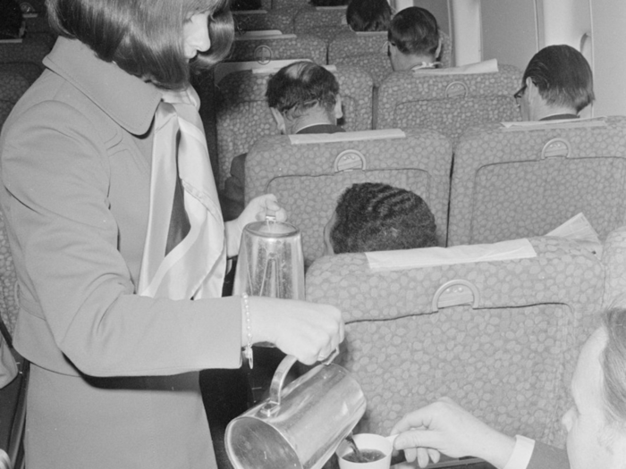 A stewardess pours coffee during a 1971 flight to Rome.