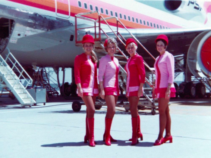 Pacific Southwest Airlines (PSA) stewardesses pose on the tarmac.