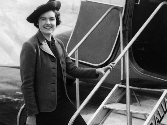 Air hostess Dorothy Webster boards a plane in 1938 in Queensland, Australia.