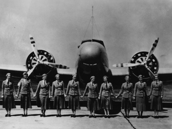 United Airlines stewardesses line up in front of an early Boeing 247.