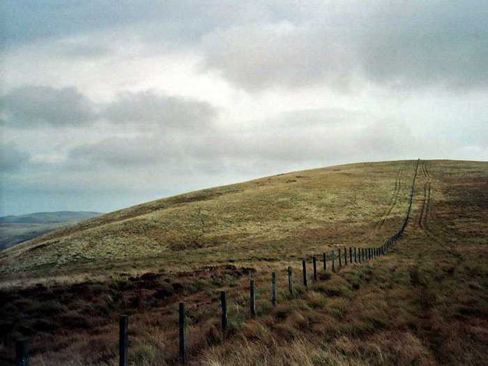 The Anglo-Scottish border, the border between England and Scotland, runs for about 96 miles between Marshall Meadows Bay on the east coast and the Solway Firth in the west. The fence shown here is one of the markers of the border.