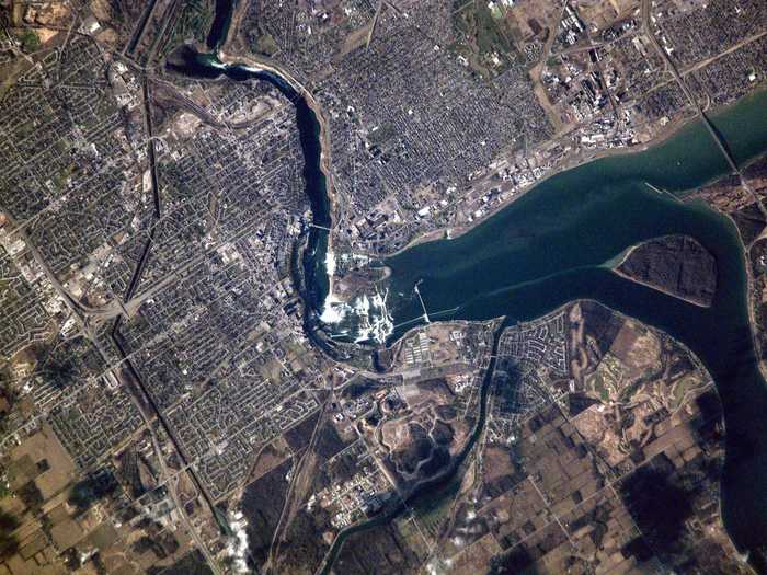 The US and Canada have one of the longest international borders in the world, spanning around 5,500 miles. This image shows Niagara Falls separating the two countries, with parts of Canada pictured on the left and the US pictured on the upper right.