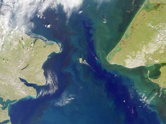 The Bering Strait separates the Seward Peninsula of Alaska to the east and Chukotskiy Poluostrov of Siberia to the west. The boundary between the US and Russia lies between the Big and Little Diomede Islands, visible in the middle of the photo here.