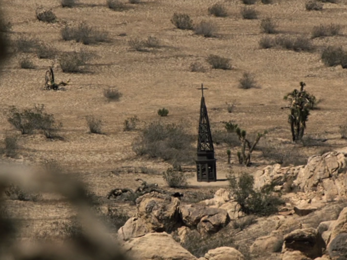 Then Ford saw this blackened steeple in the distance.